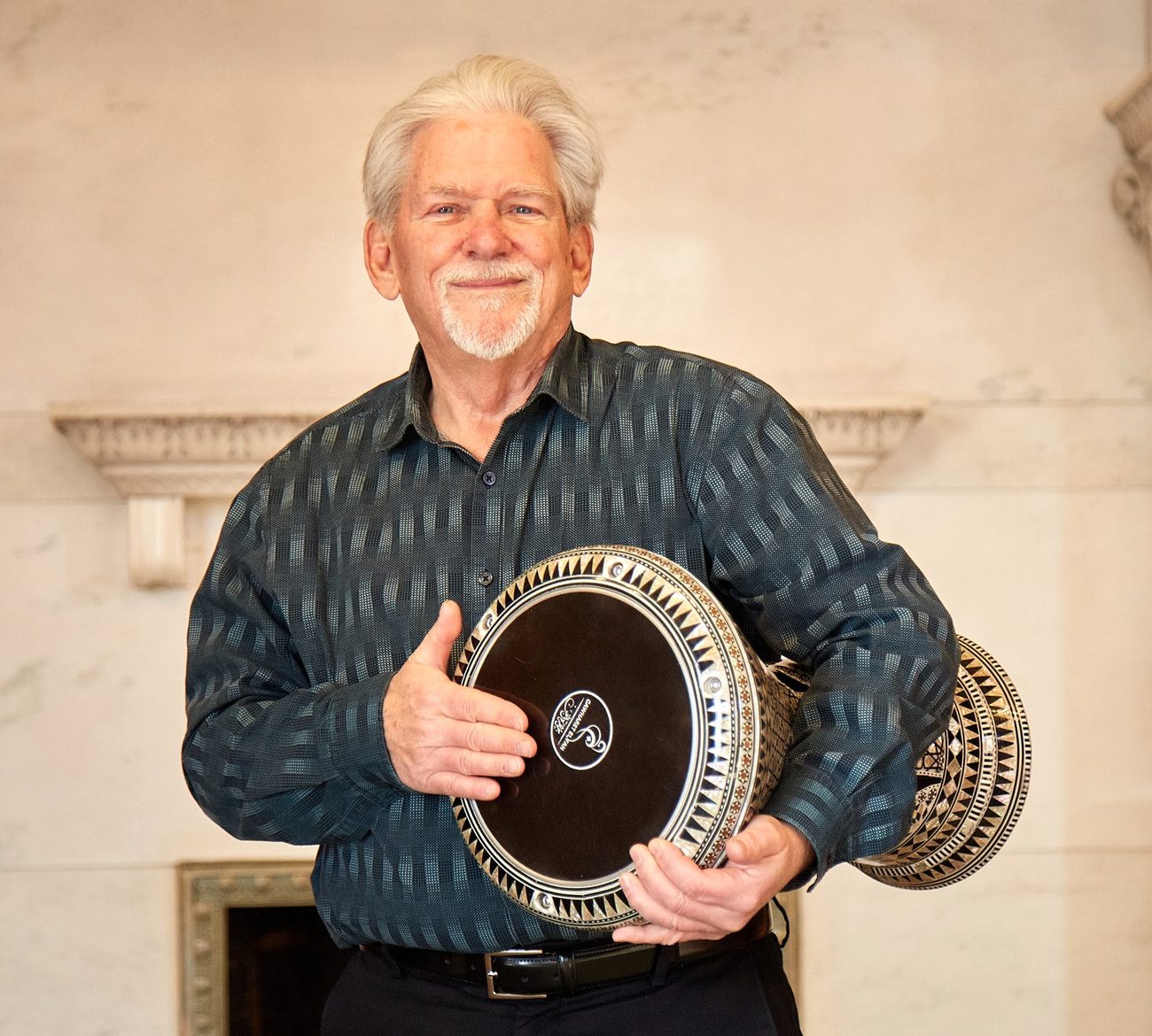 Tim O'Keefe holding a darbuka